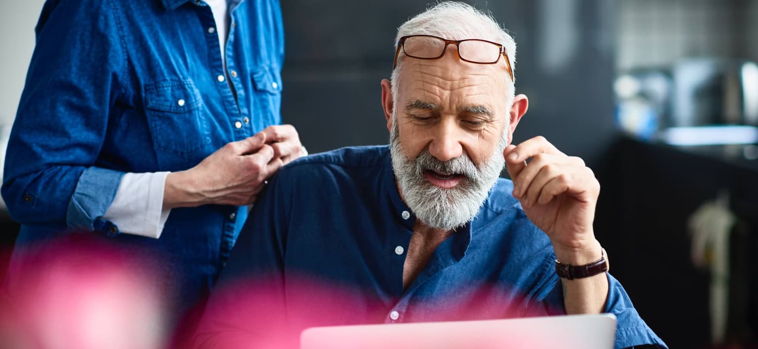 Image of elderly male on laptop