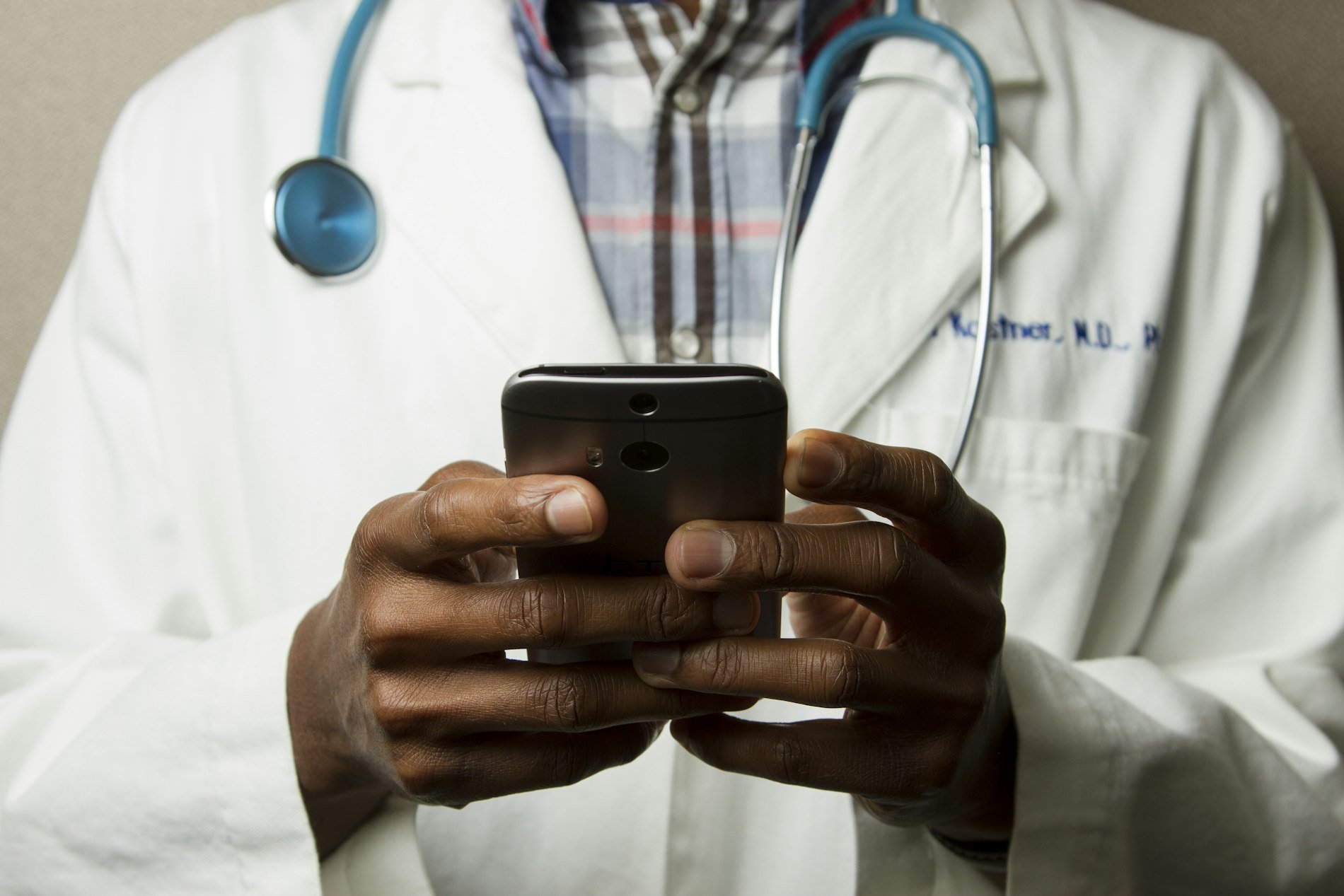 A clinician using a smartphone for telemedicine