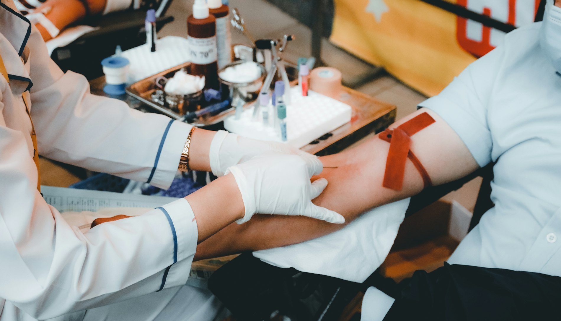 A phlebotomist performing a blood draw