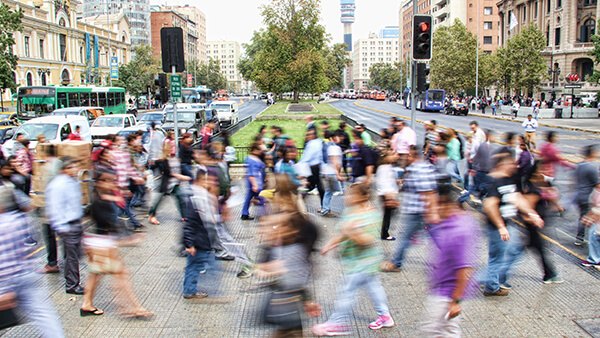 People crossing a busy city street