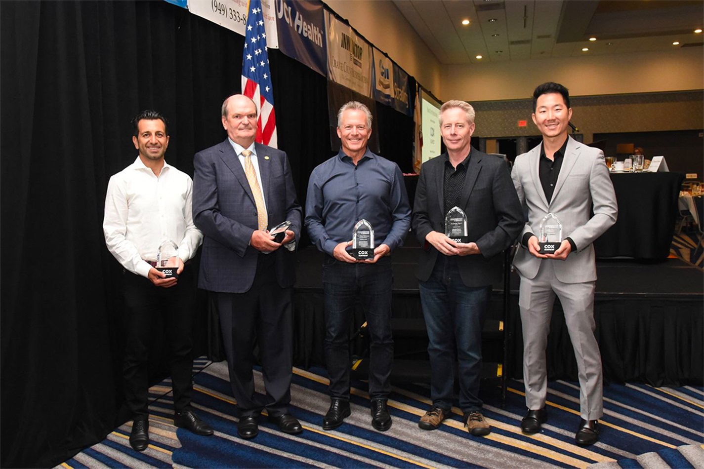 The five Orange County Business Journal Innovator of the Year honorees on stage with their awards