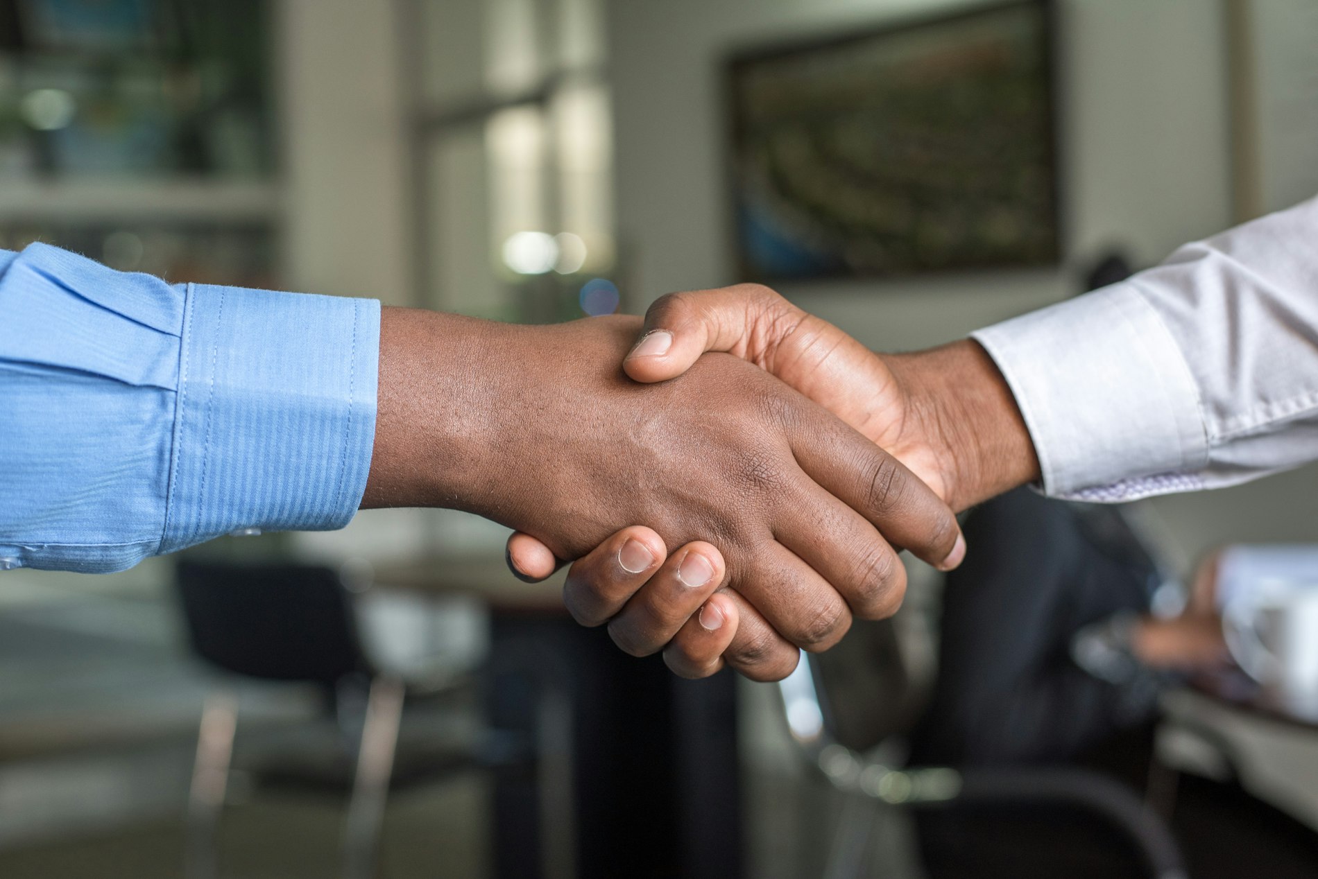 Helio Genomics and Syneos Health commercial partnership handshake