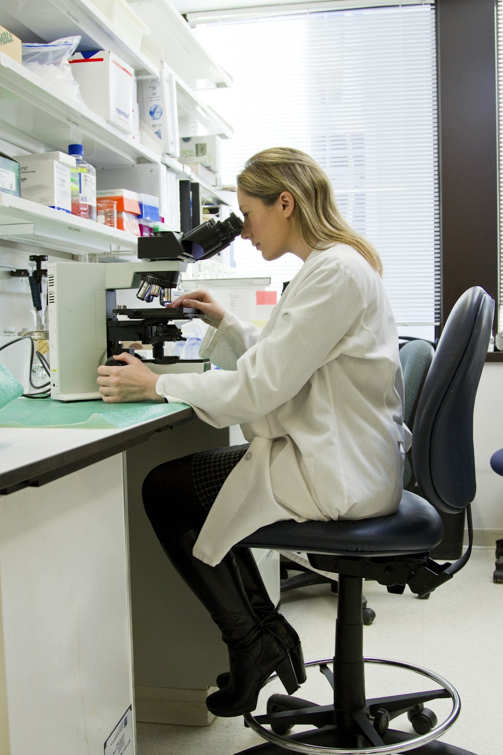 Researcher analyzing samples in a genomics laboratory