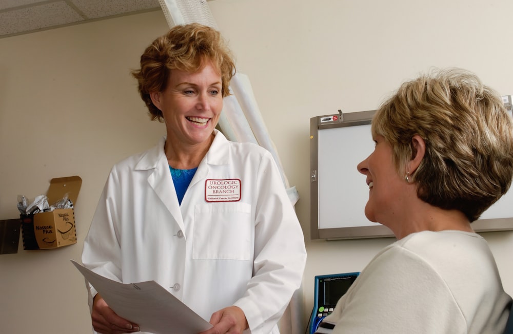 Healthcare professional in a friendly discussion with a patient