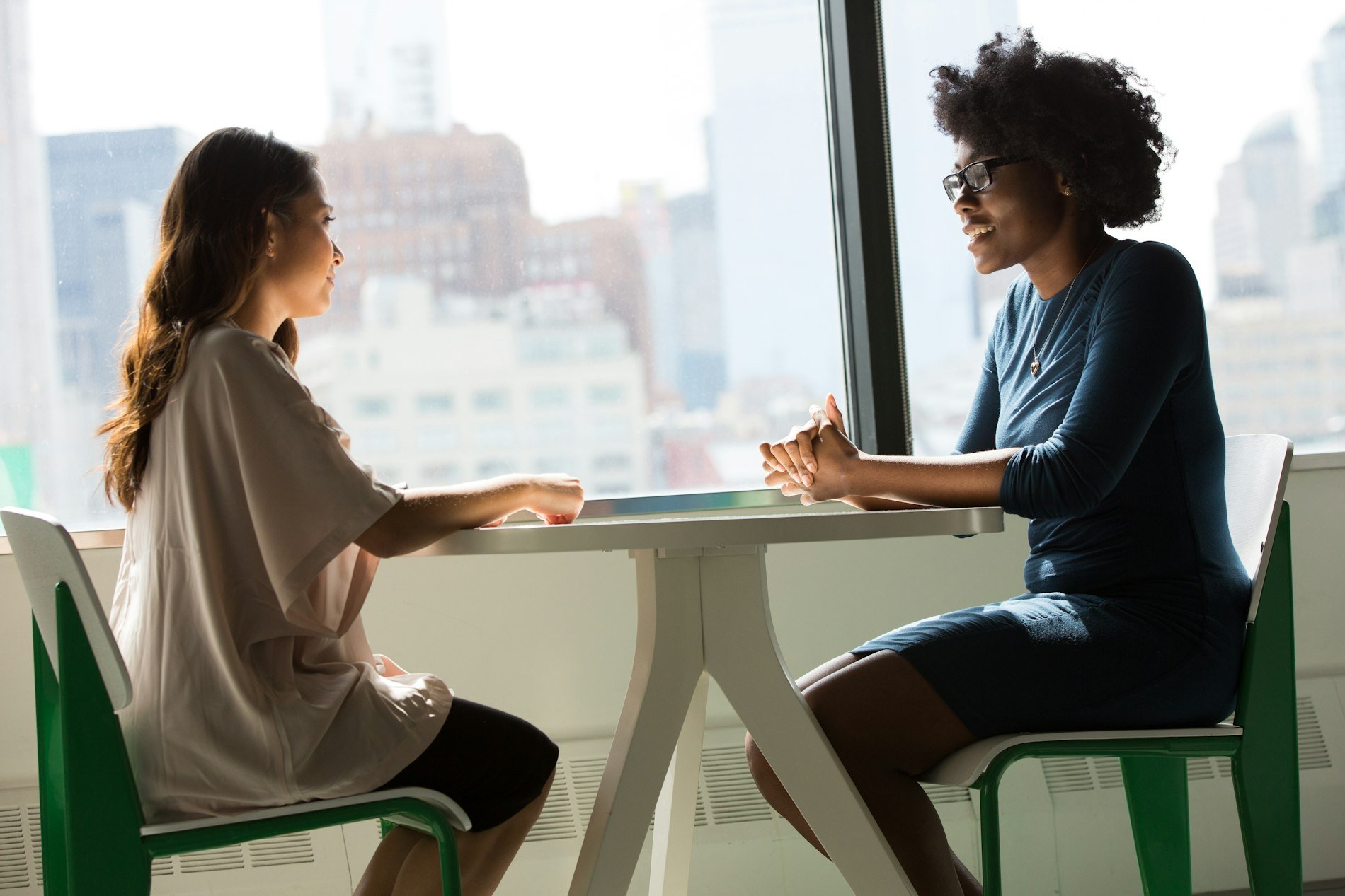 Two professional women in a business meeting